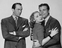 Joan Blondell, Dick Powell and Lee Bowman in a publicity shot for "Model Wife" (1948).