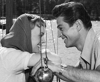 "Han glömde henne aldrig" (aka "The Long Search") photo of Anita Björk and George Nader in a scene of the 1952 movie.