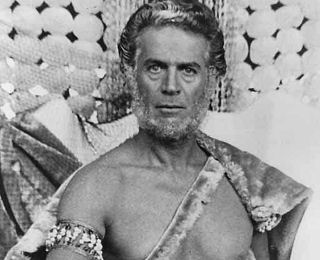 George Nader bare-chested in "Beyond Atlantis" (1973).