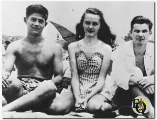 Candid picture George Nader (left) during High School years with friends at the beach.