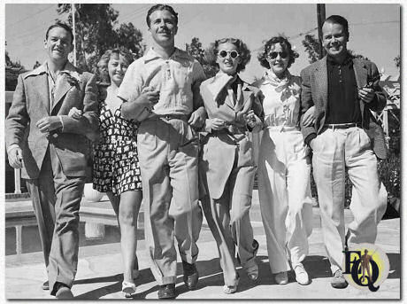 L-R) Bill Gargan, Joan Blondell, Dick Powell, Betty Davis, Mary Kenny, and Regis Toomey at a pool party thrown by Powell, 1936.