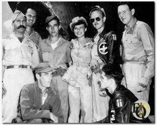 After touring China bases, the troup visited bases in India. Here, Paulette Goddard poses with 490th Bomb Squadron personnel at Kurmitola, India. Pilot 1Lt. Angelo J. Brush Mus. William Gargan is on the right.