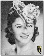 Helen Lewis CBS actress, chooses a valentine hat of roses and tulle (1942).