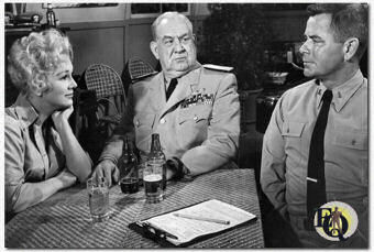 Eva Gabor, Howard Smith and Glenn Ford in "Don't Go Near The Water" (1957).