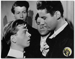 Peter Lawford's first role in a major film production was in "A Yank At Eton" (1942), starring Mickey Rooney, in which Lawford played a snobbish bully.