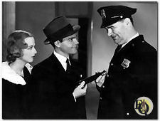 Charlotte Henry and Eddie Quillan have to do some explaining in "The Mandarin Mystery".