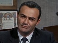 As US Intelligence Agency Official (uncredited) in Hitchcock's "North by Northwest" (1957), Dobkin discusses the plight of the hero, who has been mistaken for an agent who doesn't exist and has now become a murder suspect. "It's so horribly sad," he says drily, "why is it I feel like laughing?" 