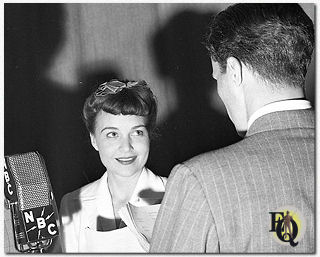 Marion Shockley (Nikki) opposite Carleton Young as Ellery Queen  in a photo for episode 92 "The Midnight Visitor" (1942).