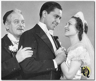 Abie (Richard Bond) shows his Irish Rose (Marian Shockley) to Poppa (Alfred White).