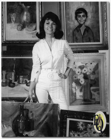 Nina Roman has discovered painting. Here she is with some of her creations, including a portrait of her 10-year-old son (upper right). When not painting, she portrays a troubled single girl on NBC's daytime serial, "Morning Star" ("Binghampton Press", Mar 19. 1966).