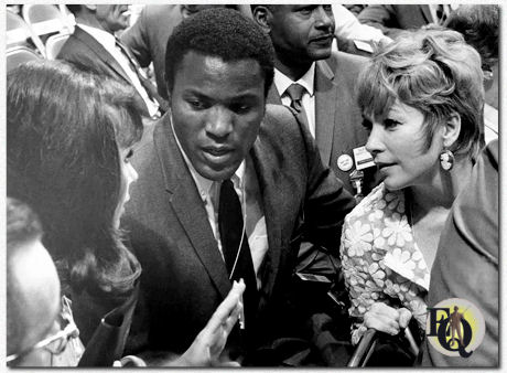 Nina Roman, American athlete and actor Rafer Johnson, actress Shirley MacLaine, among the California delegation on the first day of the 1968 Democratic National Convention, held at the International Amphitheatre in Chicago, Illinois, August 26. 1968.