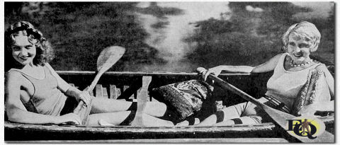 Two pretty stars of Educational comedies, Marian Shockley and Estelle Bradley, pose for a summer scene. If you live in the blustery portion of America, forget your chills and think of these pleasant California moments. Part of a series of photos.