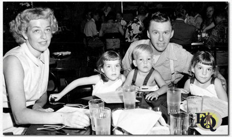 Actor ages 56 years in new role. Actor David Wayne, who ages from 21 to 77 for his role in a new Hollywood production is shown as he is off-screen, with his family in the studio commissary. Left to right: Mrs. Wayne; Melinda, 5; Tim, 4; and Susan, 5. (Nov 25. 1951)